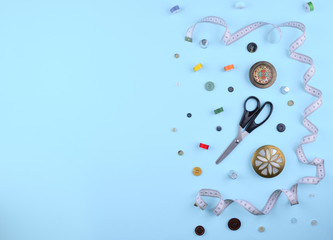 Background with sewing tools and accessories.