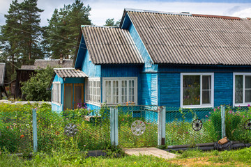 A typical residential wooden house in settlement in Leningrad region, Russia.