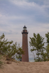 Little Sable Lighthouse / A lighthouse on a beach along Lake Michigan.