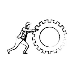 businessman pushing a big gear cogwheel silhouette blurred monochrome