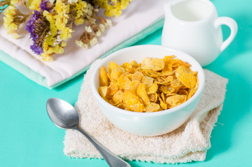 Corn flakes in a bowl with spoon for eating in the morning,breakfast or meal