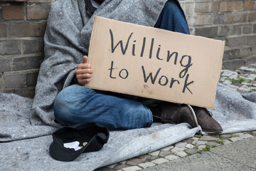 Homeless Man Holding Cardboard With Text Willing To Work