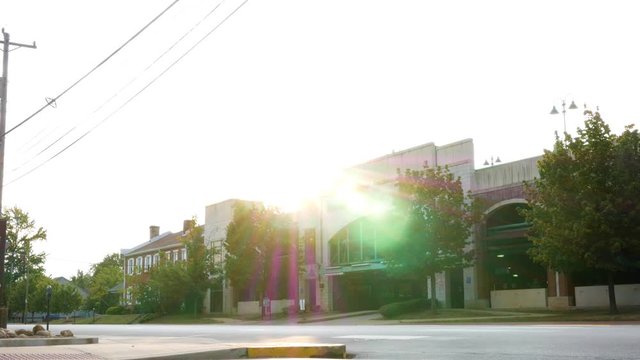 Evening establishing shot of a parking garage in suburban community