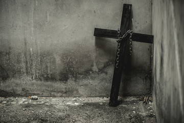 Black cross with a looped chain. And being placed in isolation in the basement of the old. But fear...