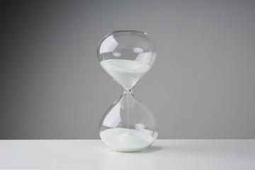 Studio photo of a hourglass,sand clock, business time management concept .