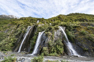 Fototapeta na wymiar Franz Josef Glacier and waterfall,South Island New Zealand