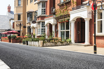 Fototapeta premium British style apartment building and asphalt road in the Thames town of Shanghai