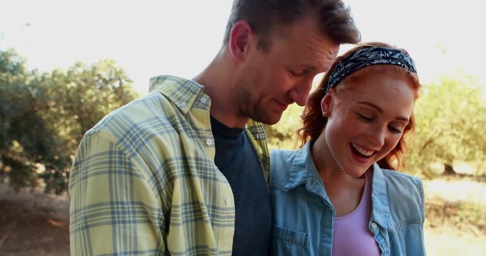 Happy couple using mobile phone 