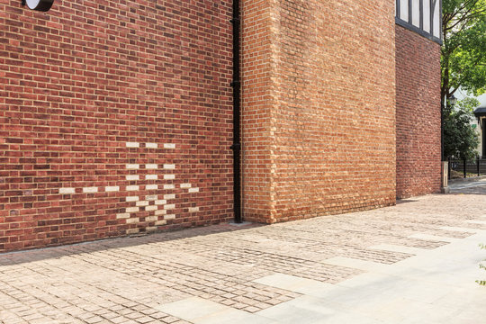 Fototapeta Red brick wall and empty floor sidewalk