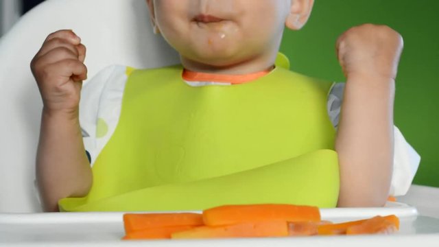 Baby eating carrot, baby led weaning