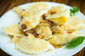 boiled dumplings with potatoes and fried onions