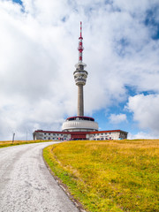 Asphalt road leading to TV transmitter and lookout tower on the summit of Praded Mountain, Hruby...