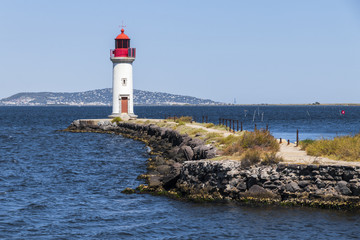 The Les Onglous lighthouse, terminating point of the Canal du Midi where the it enters the Etang de Thau. World Heritage Site. Agde, France