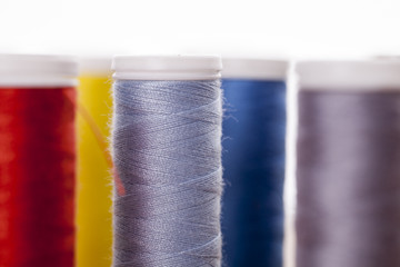 Sewing instruments, threads, needles, bobbins and materials.