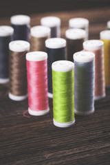 Sewing instruments, threads, needles, bobbins and materials.