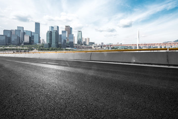 empty asphalt road with cityscape of modern city