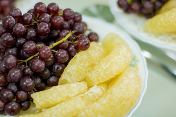 delicious  fruit , grapes, dragon fruit , melon  on the white bowl , healthy food for everybody with copy space