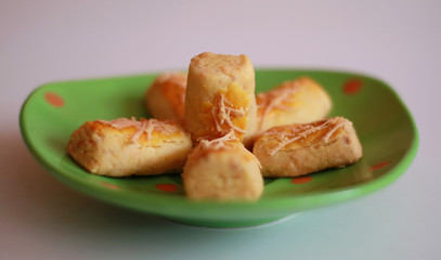 Kastengel or Dutch Indonesian cheese stick cookies and a cup of tea