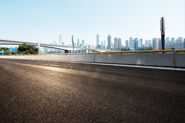 empty asphalt road with cityscape of modern city