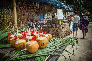 Exotic coctails made of fresh coconuts and the tourists, Seychelles