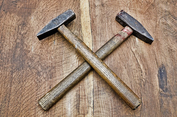 hammer in cross position on wood close up
