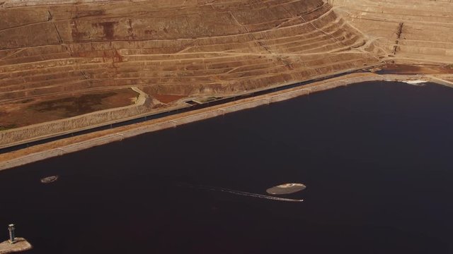 Waste water purification reservoir in Kuryanovskaya WWTP at spring sunny day. Aerial view 4k