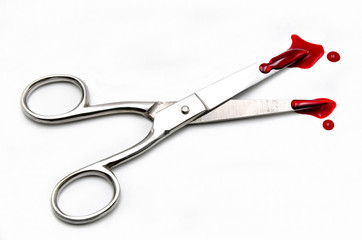 scissors with blood on a white background