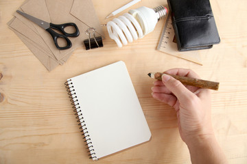Notepad, light bulb and pencil