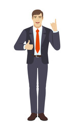  Businessman pointing up and showing thumb up