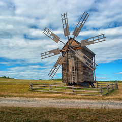 Fototapeta na wymiar Ancient windmill on the field. Ukraine