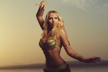 Beautiful blonde belly dancer woman