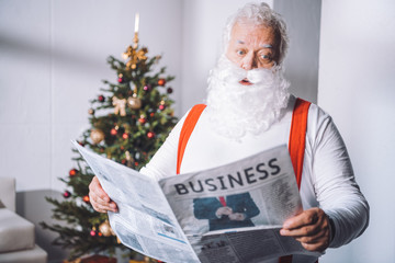 santa claus reading newspaper