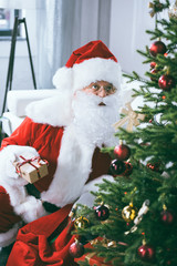santa claus with christmas gift