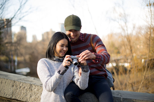 Photographer couple taking pictures in Central park