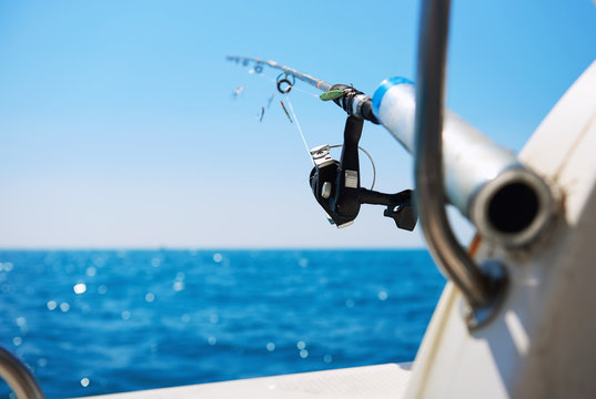 Fishing rod and Mediterranean Sea, selective focus