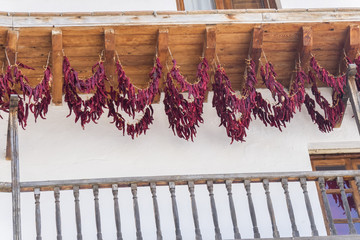 Red peppers drying in the sun on the balconies, tradition in Cazorla, Jaén, Spain