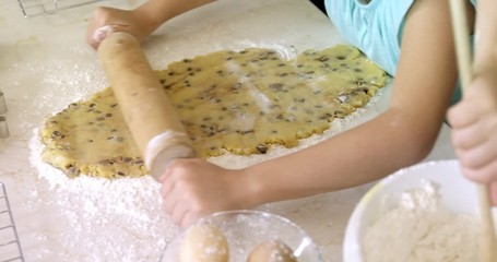 Kids preparing dessert in kitchen