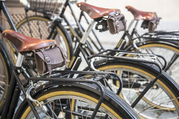 Fototapeta na wymiar Row of bicycle tires on bicycle rental station