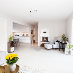 cozy living room with lit fireplace