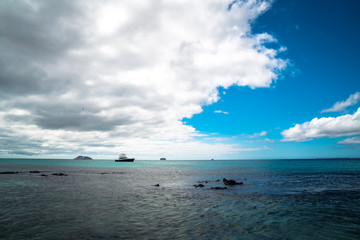 Isolated Tropical Island Beach with Beautiful Sea Waves. Blue Sky, Paradise Nature Background....