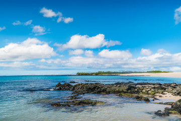 Beautiful Blue Ocean, Galapagos. Waves on the Beach with Blue Sky Background. Tropical Nature Landscape. Tropical Paradise Isolated Island. Clean Blue Ocean View. Nobody Sea Tropical Pattern. Summer