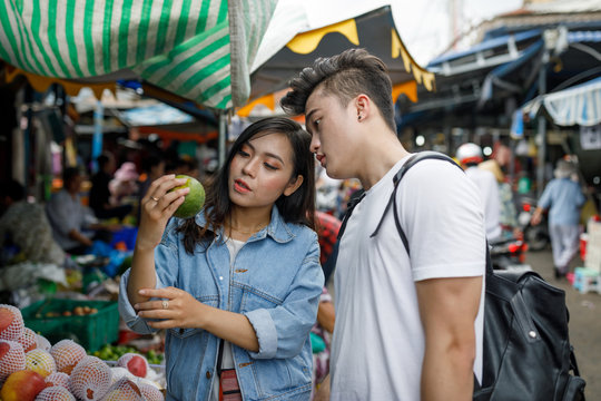 Young Couple Sightseeing at Local Market in Vietnam