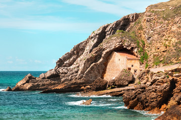 Fototapeta premium Ermita Santa Justa in Cantabria, Spain, next to the sea