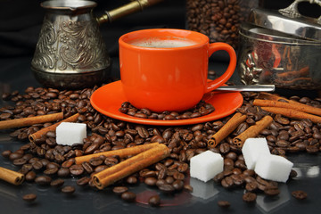 Coffee still life with an orange mug and a sugar bowl