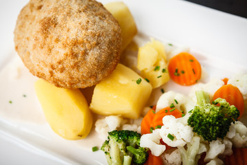 Chicken Kiev with vegetables