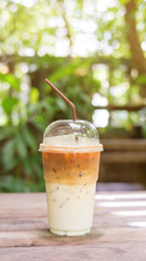 iced latte coffee on a wooden table.