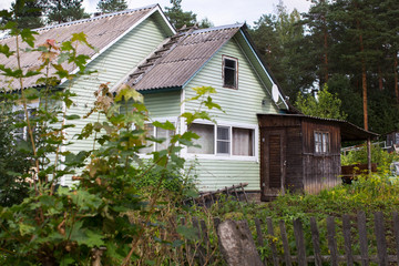 A typical residential wooden house in settlement in Leningrad region, Russia.