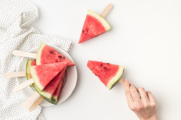 watermelon slices on sticks - Powered by Adobe