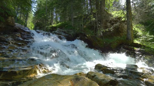 4k nature video waterfall and river over wet stones in forest
