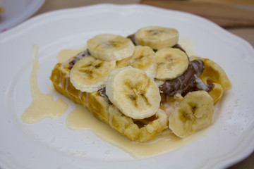 Belgian waffle with ice cream, chocolate and mint